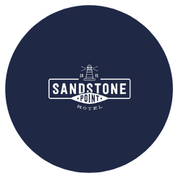 dark blue circle logo for Sandstone Point a venue for wedding stylists