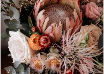 King Protea bridal bouquet with roses and native foilage with preserved tiki fern